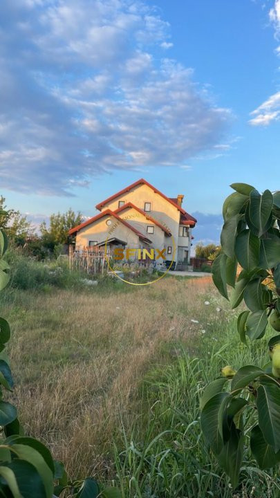 Casa la rosu cu teren 1973 mp Domnesti